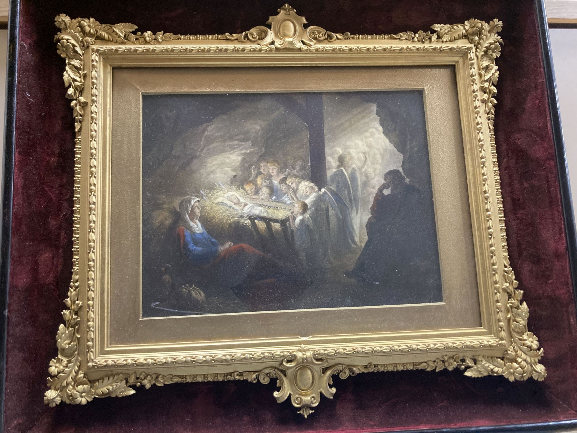 A Victorian hand coloured lithograph of The Adoration, housed in an ornate gilt gesso frame, 18 x 23.5cm, overall 37 x 43cm